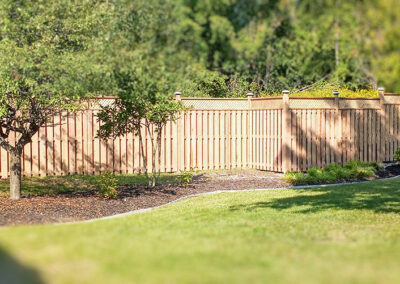 Beautifully landscaped yard with new fence